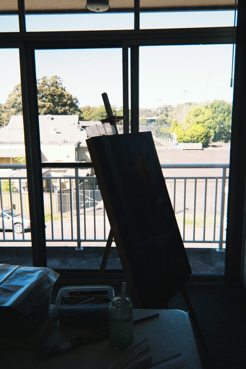 Studio easel by the window — Artwork by Hiki Reedy